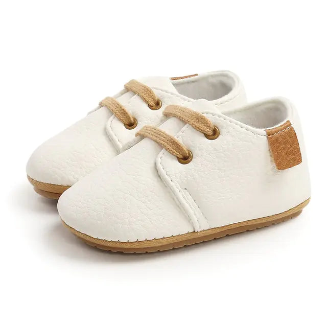 Colorful retro baby leather shoes with non-slip soles by Krystina Trendify.