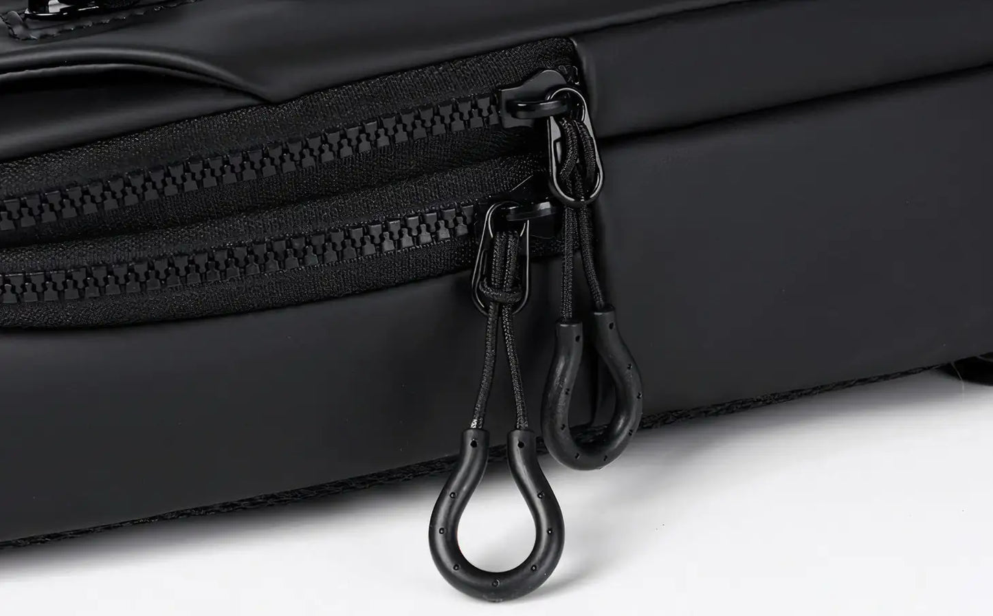 Sleek crossbody sling bag with hidden zippers, USB charging port, and adjustable strap.
