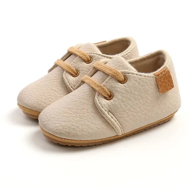 Colorful retro baby leather shoes with non-slip soles by Krystina Trendify.