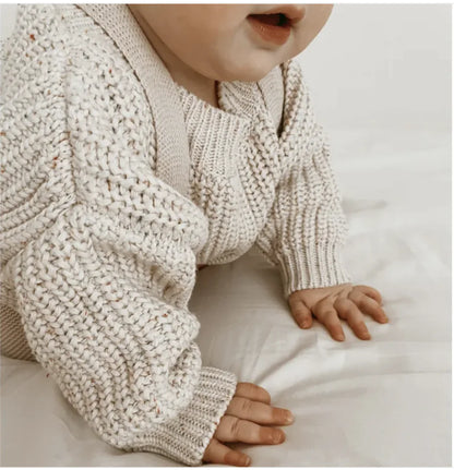 Cozy long sleeve baby sweater in offwhite, vanilla, or pink by Krystina Trendify, perfect for autumn. Available in sizes 0-3M to 2-3T.