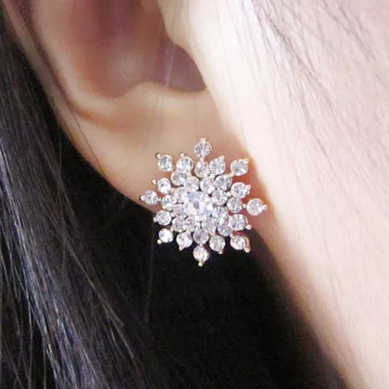 Crystal Snowflake Stud Earrings with intricate designs and dazzling crystals