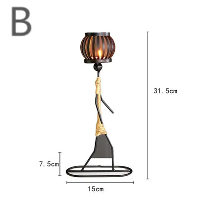 Little Man Candle Holder made of durable iron, featuring a minimalist and abstract design, ideal for adding charm and style to any room.