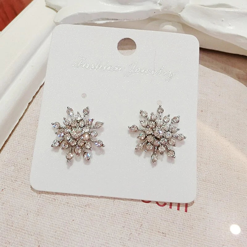 Crystal Snowflake Stud Earrings with intricate designs and dazzling crystals