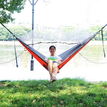 Portable hammock with built-in mosquito net by Krystina Trendify for camping and relaxation