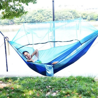 Portable hammock with built-in mosquito net by Krystina Trendify for camping and relaxation