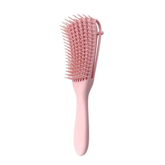 Curly hair detangling brush for reduced breakage and enhanced texture.