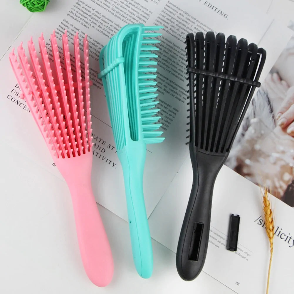 Curly hair detangling brush for reduced breakage and enhanced texture.