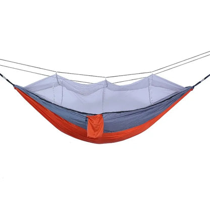 Portable hammock with built-in mosquito net by Krystina Trendify for camping and relaxation