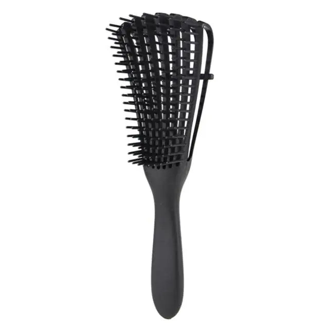 Curly hair detangling brush for reduced breakage and enhanced texture.