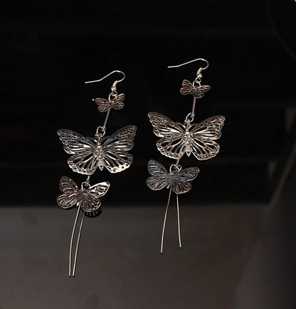 Rhinestone Butterfly Stud Earrings, crafted with shimmering rhinestones and stainless steel for a sparkling touch.