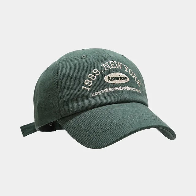 Adjustable Baseball Hat – breathable cotton cap with metal buckle strap and curved brim for sun protection, perfect for casual and outdoor wear.